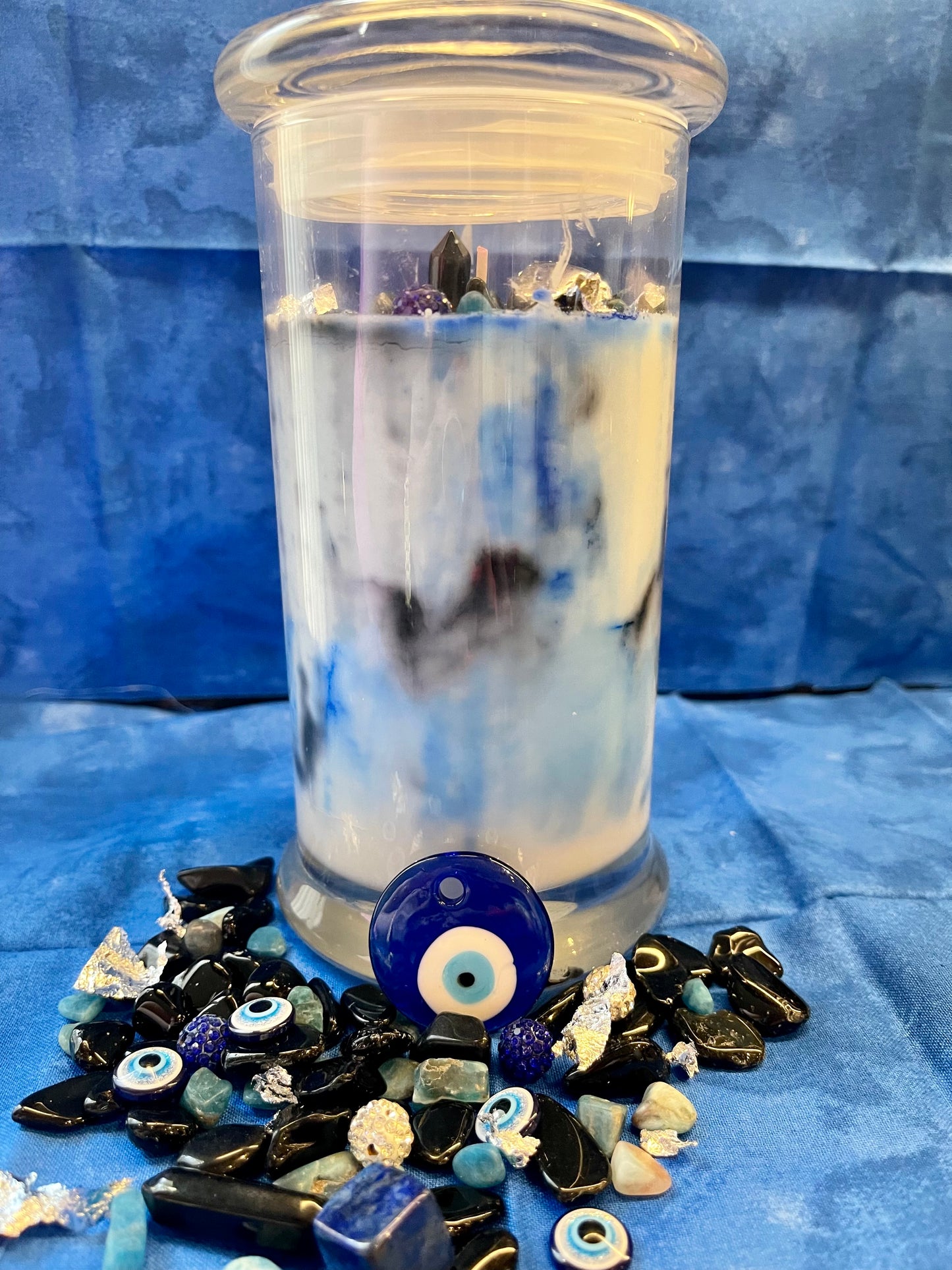 Manifest spiritual protection and ward off evil with the EVIL EYE INFUSION CANDLE