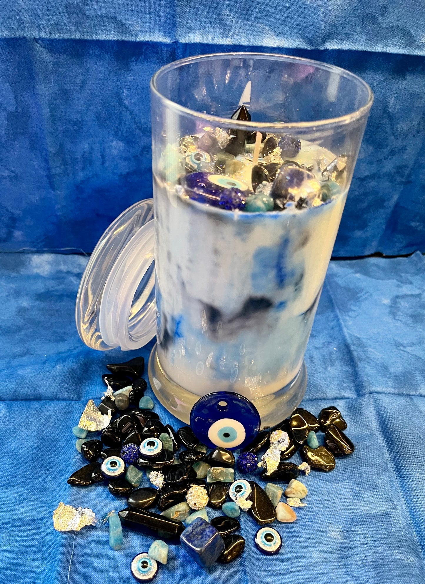 Manifest spiritual protection and ward off evil with the EVIL EYE INFUSION CANDLE